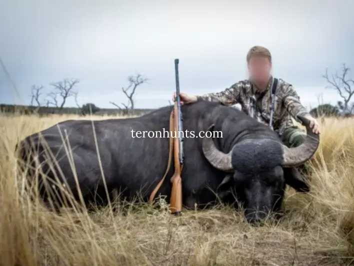 Hunter taking picture with his hunted asian water buffalo in Argentina, example of successful client of Teron who went asian water buffalo hunting in Argentina